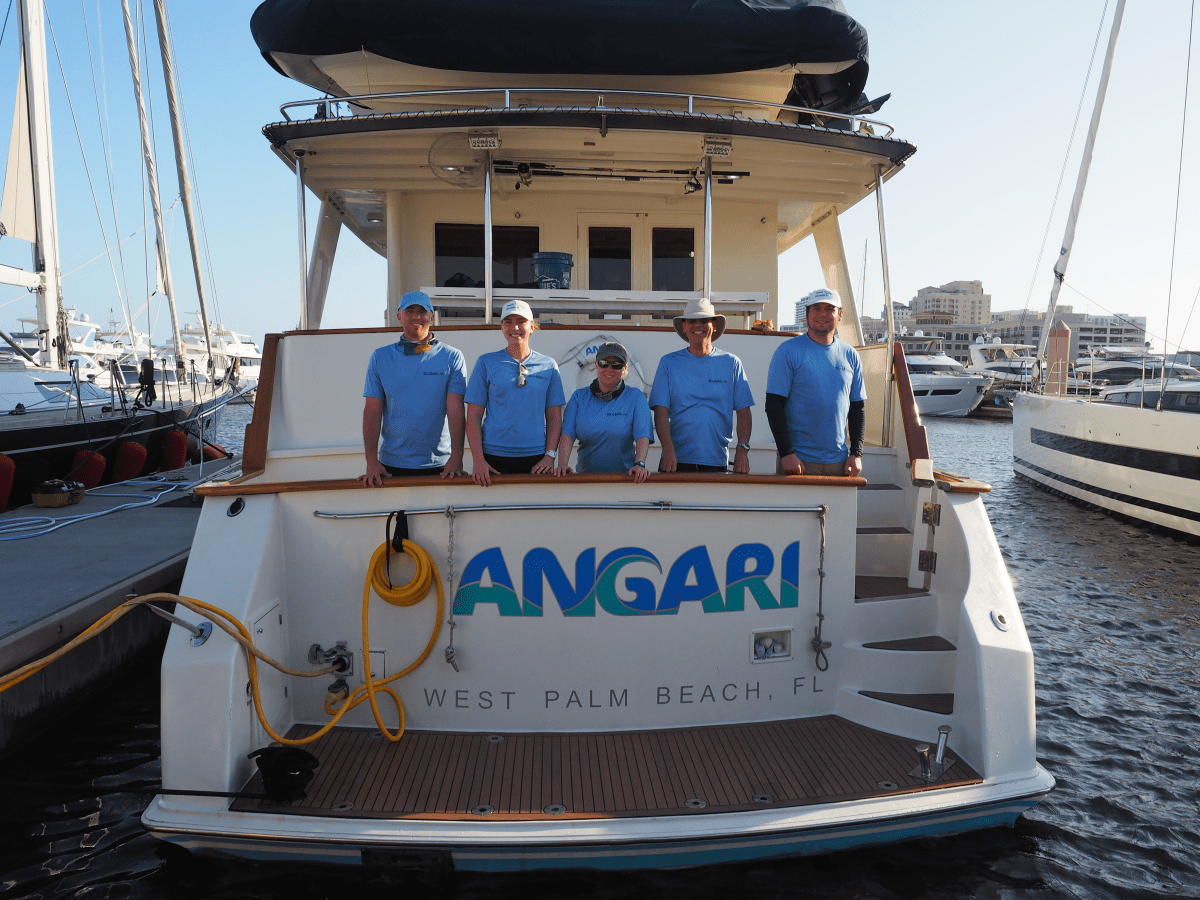 Dr. Stephen Kajiura and his team from Expedition 34 post for a photo on the back of R/V ANGARI