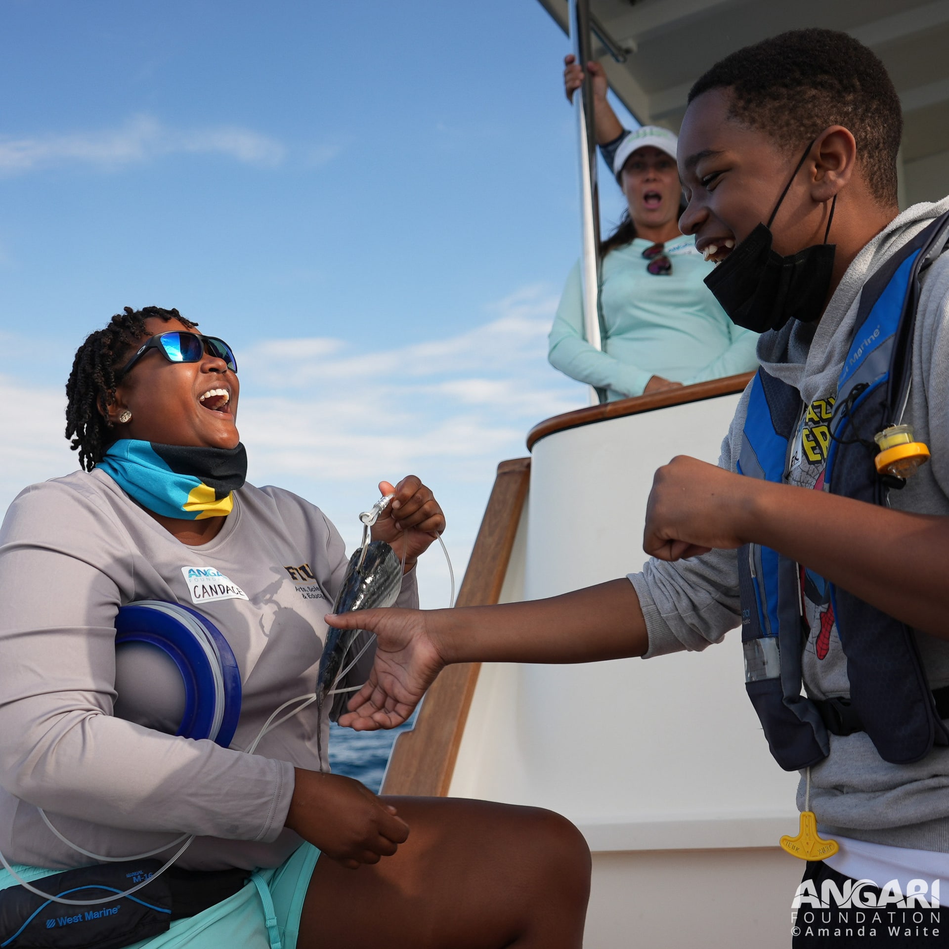 Teaching a student how to bait a circle hook on a Coastal Ocean Explorers: Sharks expedition. PC: Amanda Waite