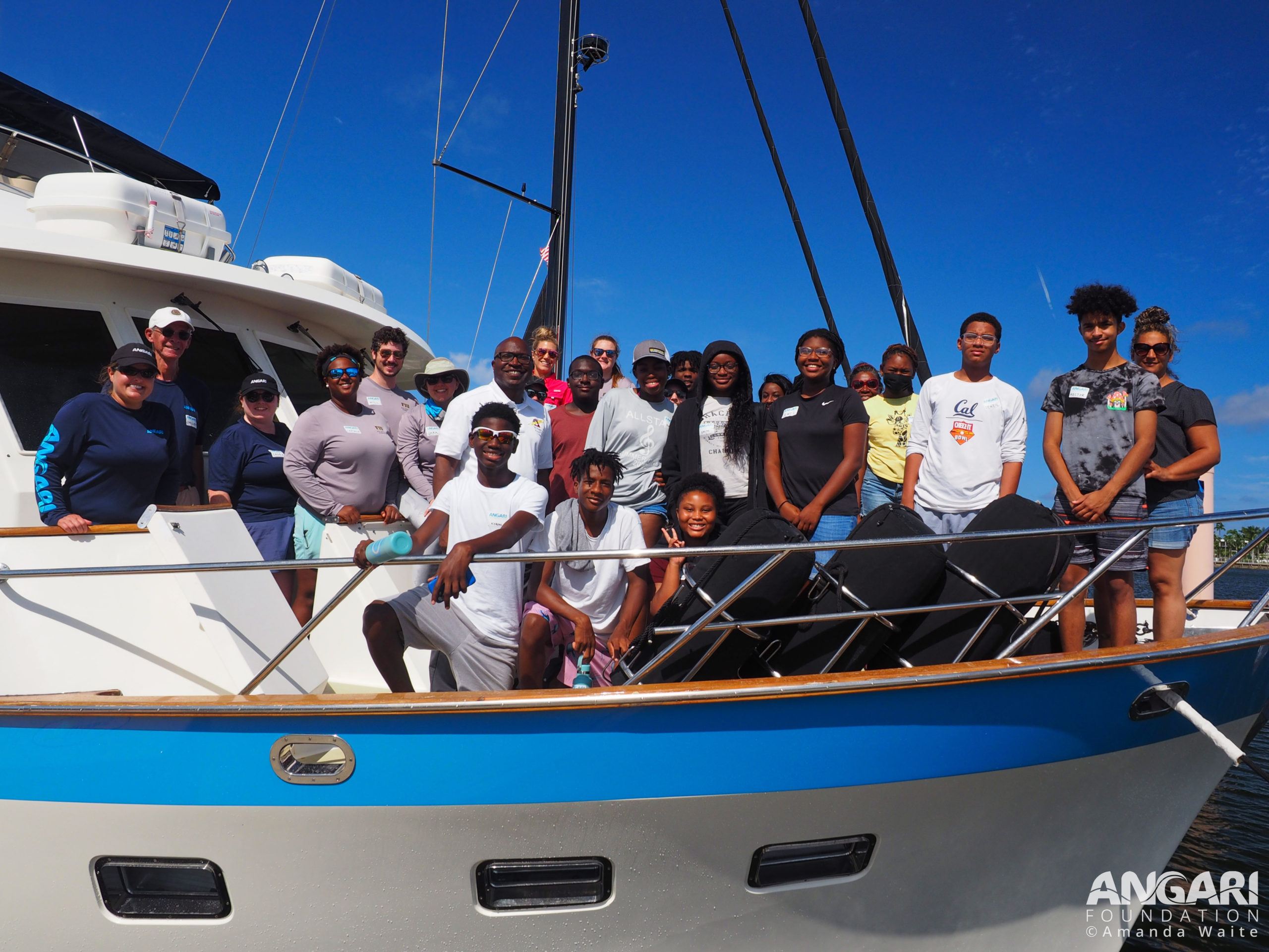 EXP 50: Back At The Docks, Everyone Takes A Photo To Celebrate A Productive Day At Sea And R/V ANGARI’s 50th Expedition! PC: Amanda Waite