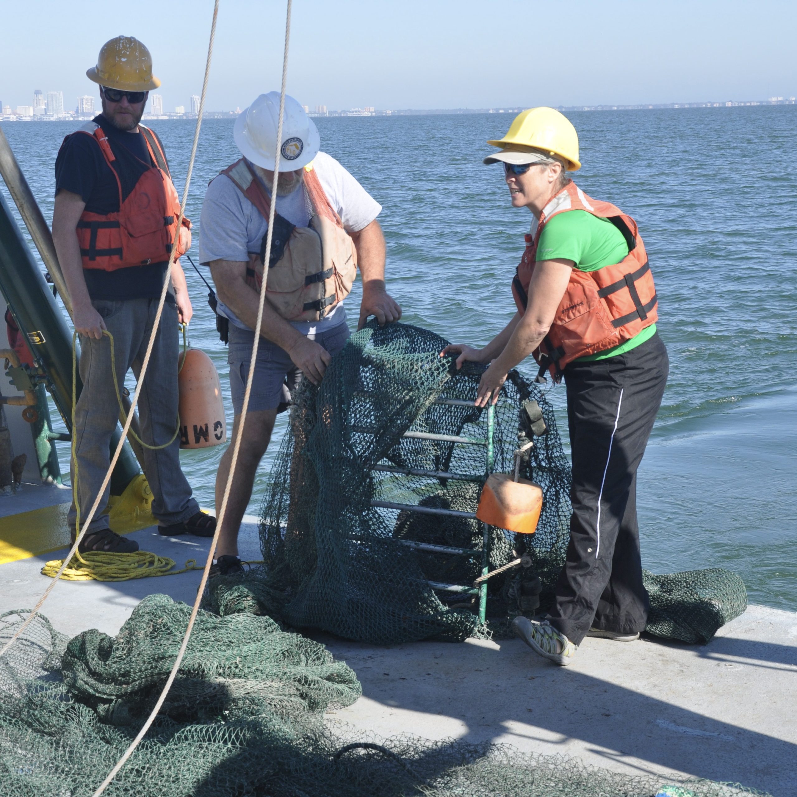Deploying a fishing trawl aboard the R/V Weatherbird II while teaching from sea during an experiential learning in marine science field course for teachers.