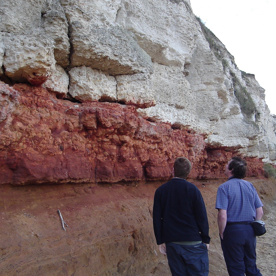 My father, Dr. John Conway, and I at an outcrop of iron-rich limonite rocks and white chalk at Hunstanton cliffs, UK.
