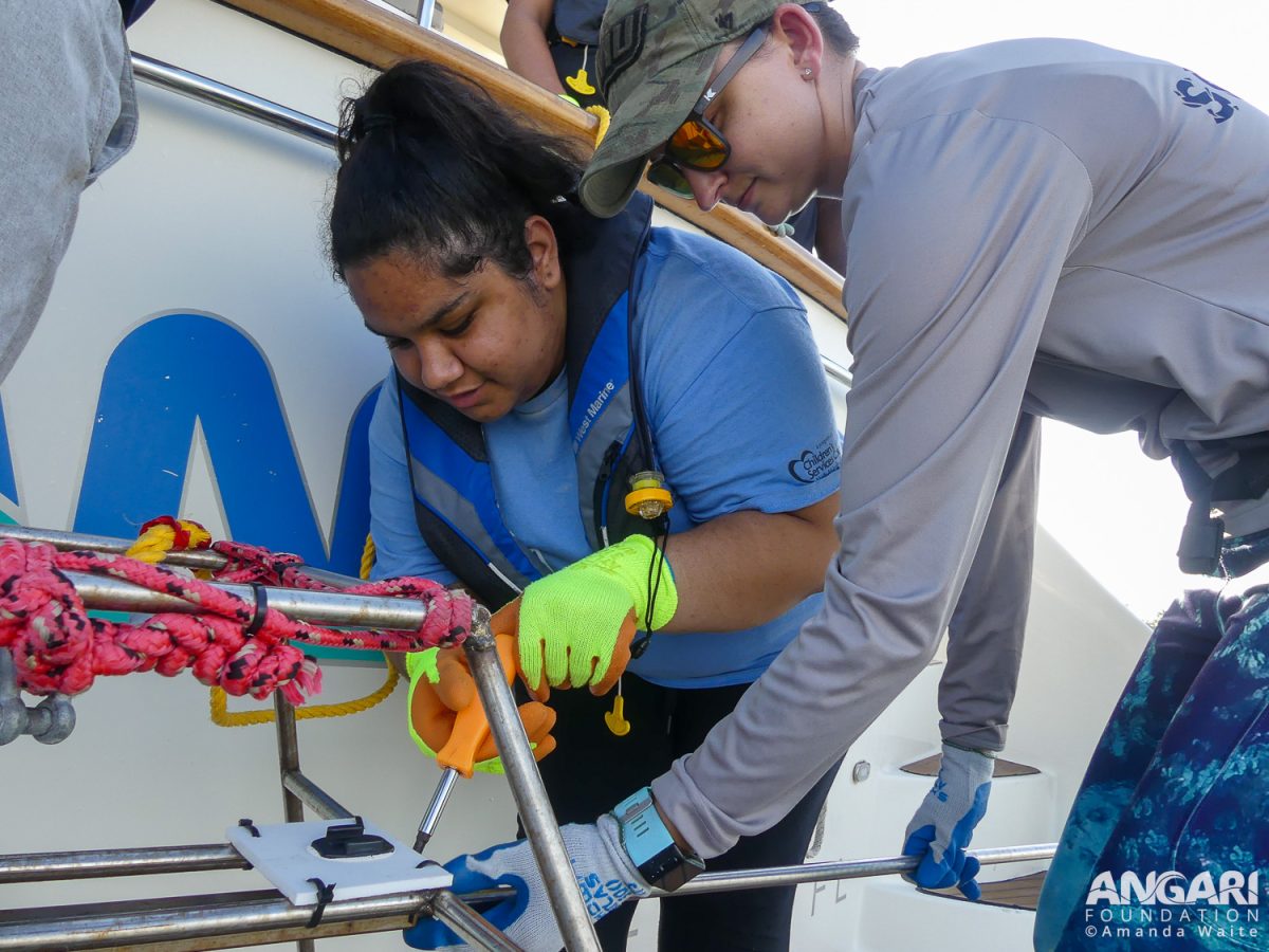 EXP 72: A Student And Scientist Work Together To Attach The Bait Arm To The Baited Remote Underwater Video System (BRUVS) Frame. PC: Amanda Waite