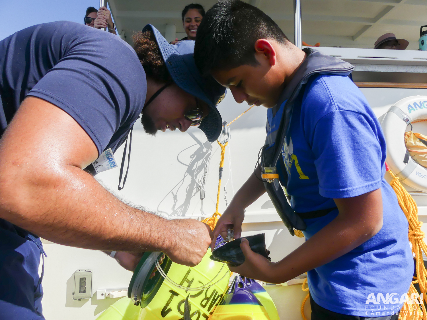 EXP 73: A Scientist Guides A Student As They Begin Attaching A Piece Of Bait To A Circle Hook. PC: Amanda Waite