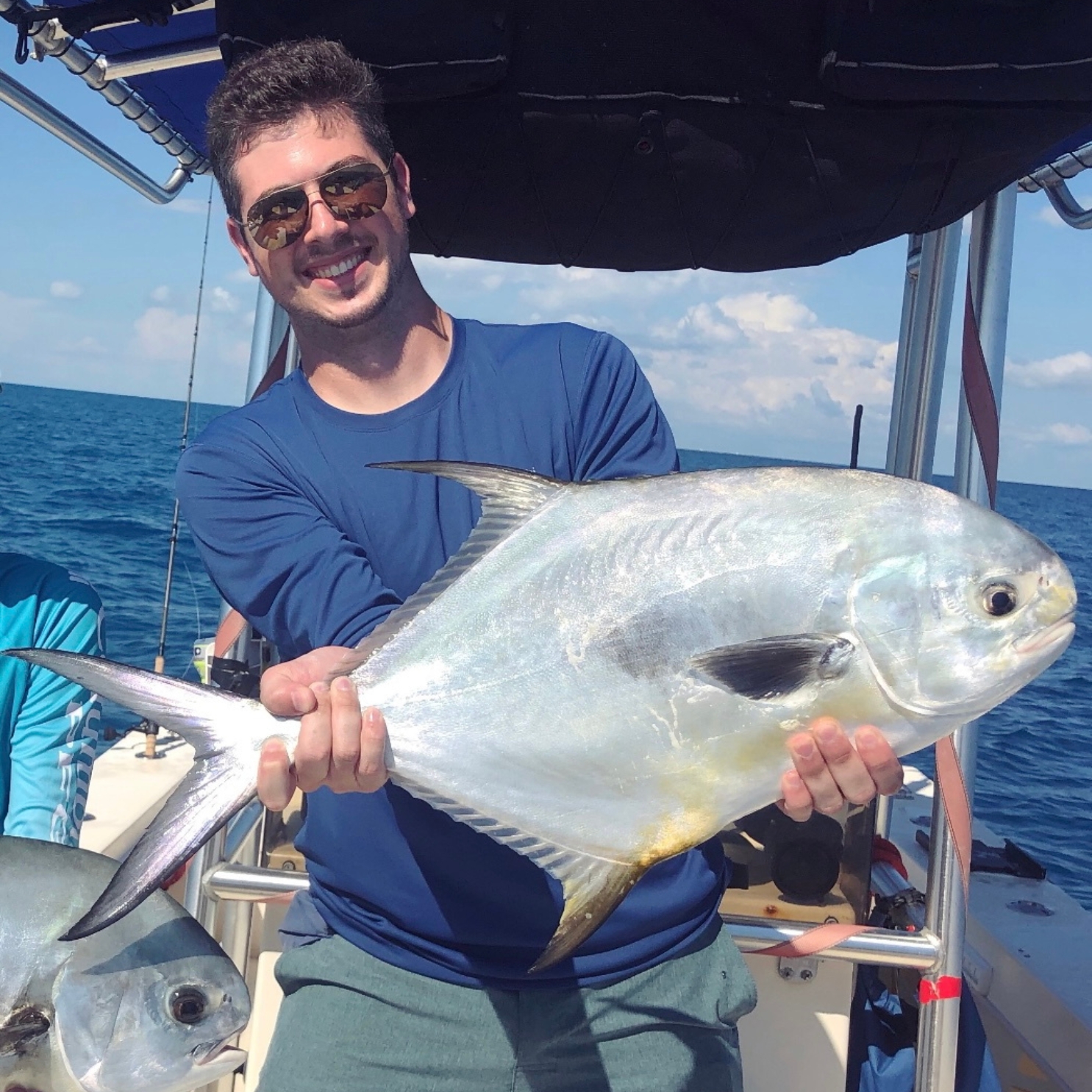 I proudly show off a permit that was caught as part of ongoing shark depredation research in the Florida Keys. PC: Ben Binder