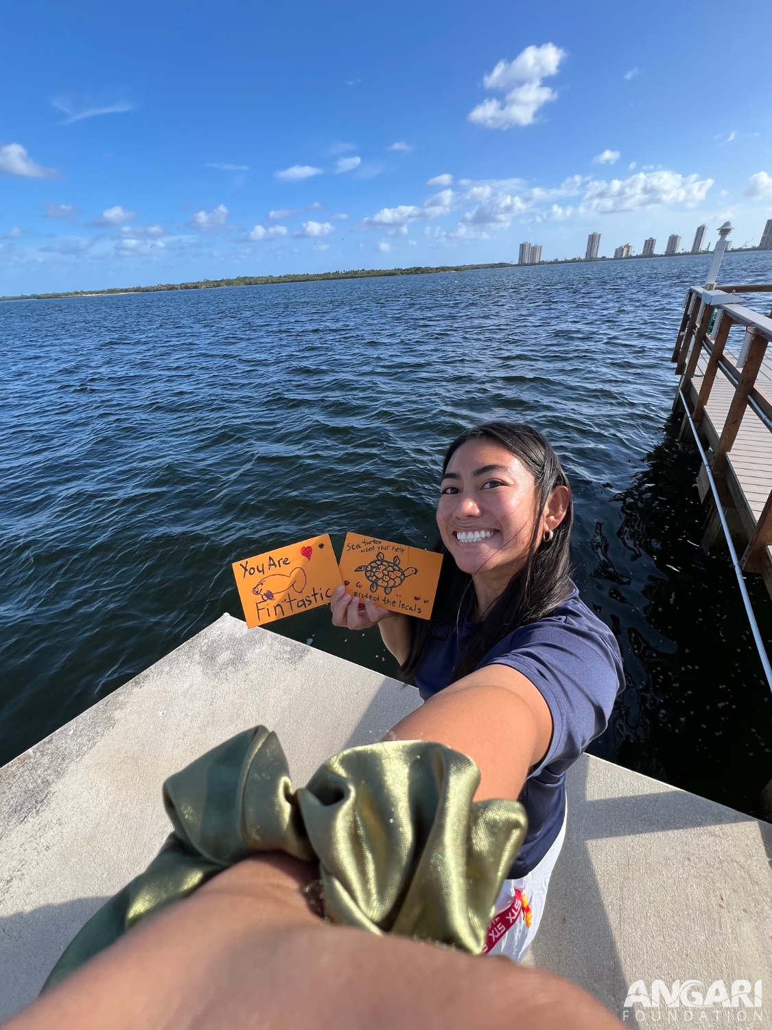 Me deploying drift cards for our November 2024 Lagoon Drift experiment. It was so exciting being able to throw the cards in and see them drift away.