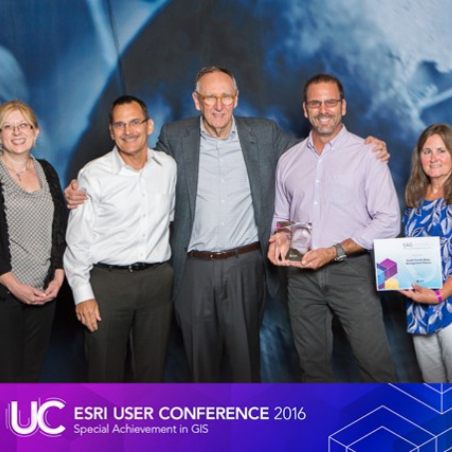 I proudly show off my trophy after winning the Special Achievement in GIS (SAG) award.