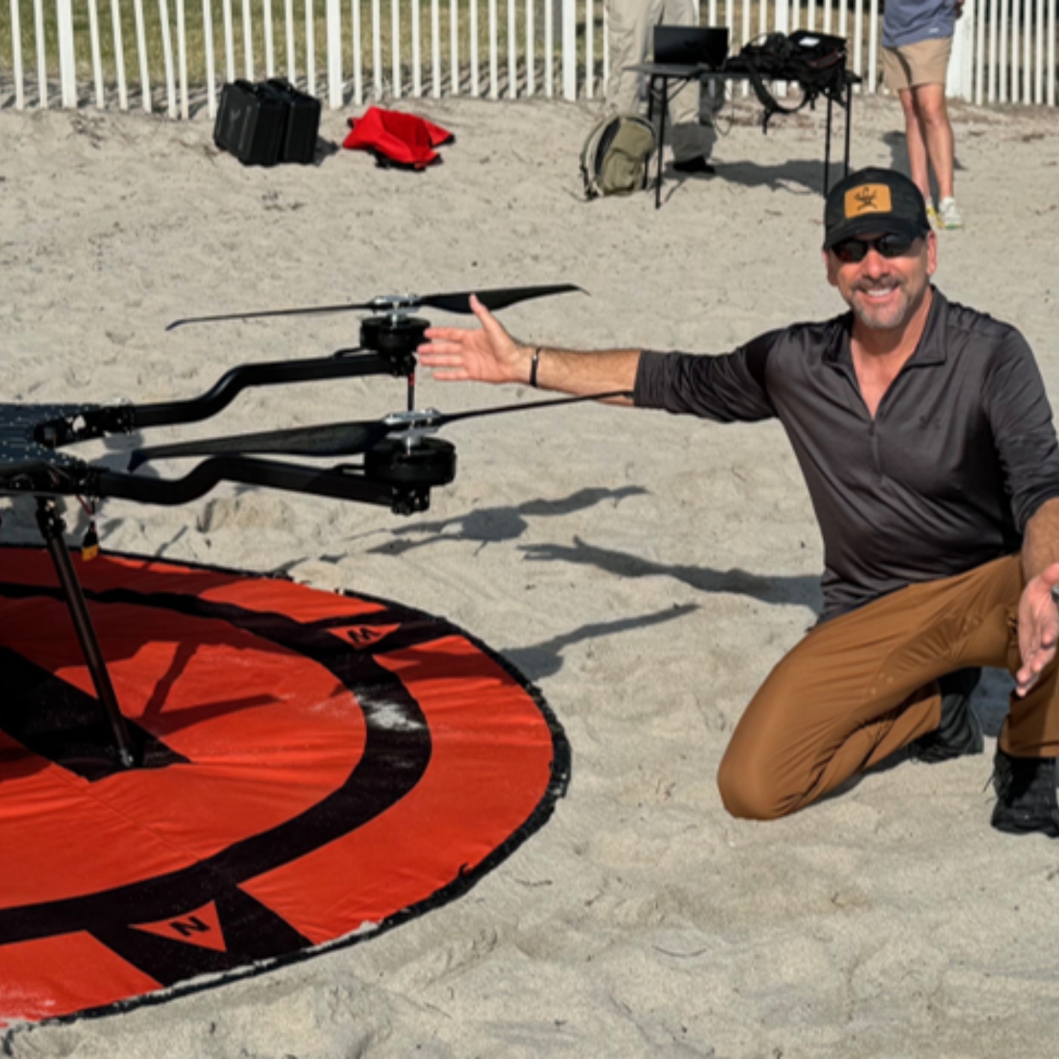 You should never skip an opportunity to pose next to a large drone while at work.