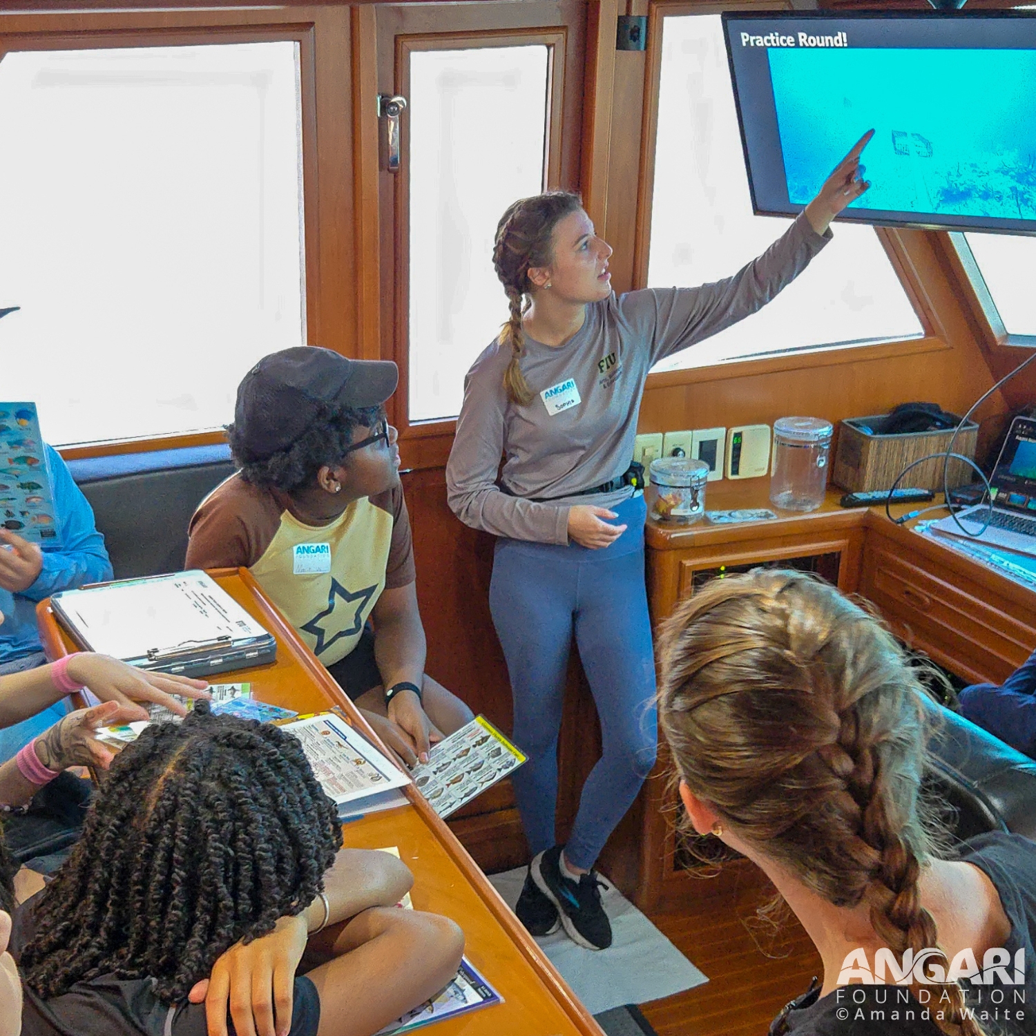 Here I am explaining how our baited remote underwater video system (BRUVS) activity works to a class. PC: Amanda Waite